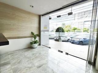 Modern building entrance with large glass doors