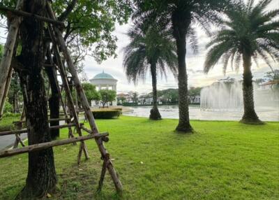 Garden with a view of a gazebo, trees, and a fountain