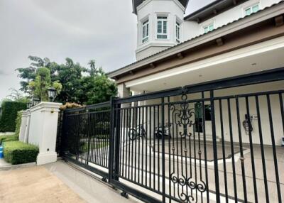 Front view of a building with ornate metal gates