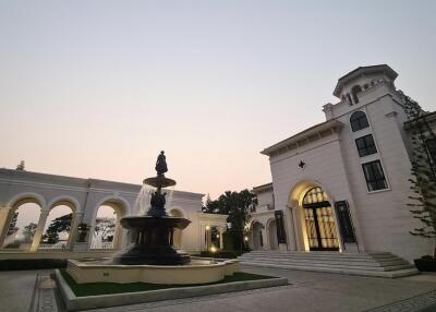 Stately building with fountain in front