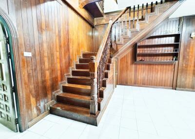 Main hallway with wooden staircase