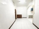 Simple kitchen with white tiles and wooden elements