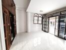 Bright and spacious living room with large windows and decorative metalwork