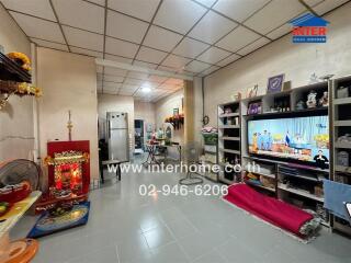 Living room with television and shelves