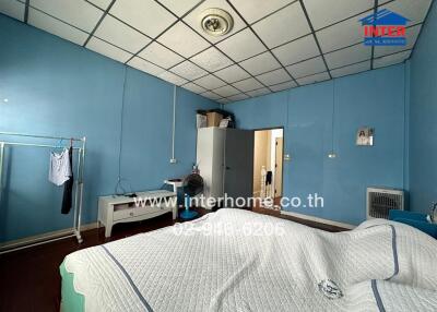 Bedroom with blue walls and a bed