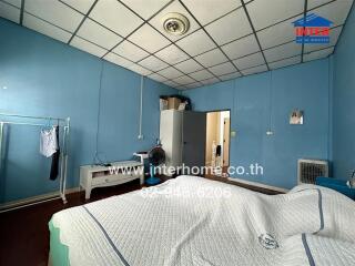 Bedroom with blue walls and a bed