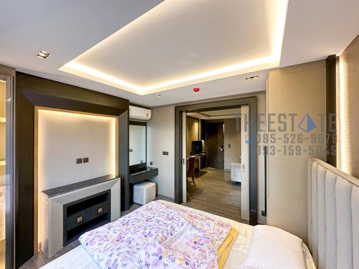 Modern bedroom with ensuite and contemporary lighting