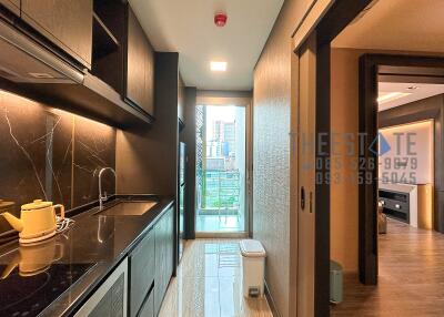 Modern kitchen with view of city from balcony