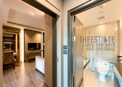 View of the living room and bathroom in an apartment