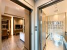 View of the living room and bathroom in an apartment