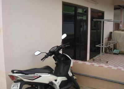 Motorbike parked near a patio area