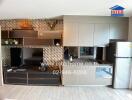 Modern kitchen area with cabinets, countertop, refrigerator, and wall storage