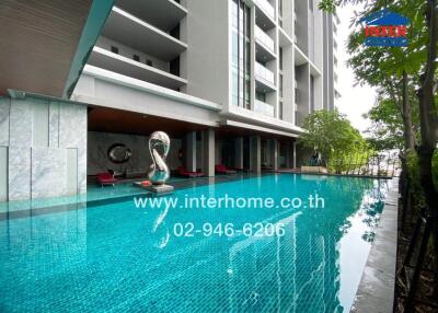 Outdoor swimming pool in a modern apartment complex.