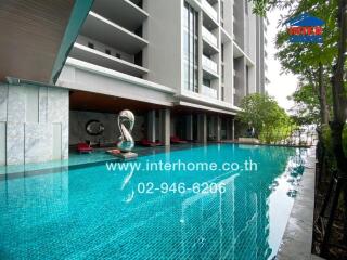 Outdoor swimming pool in a modern apartment complex.