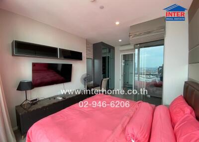 Modern bedroom with a large window and a view