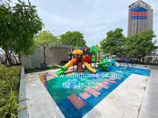 Outdoor playground with colorful play equipment and trees