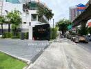 Building entrance with sign 'THE ROOM SUKHUMVIT 62'