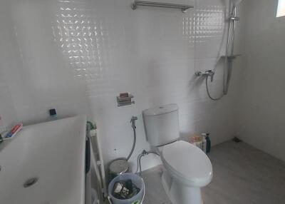 Modern bathroom with shower, toilet, and sink