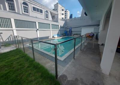 Outdoor swimming pool with surrounding buildings