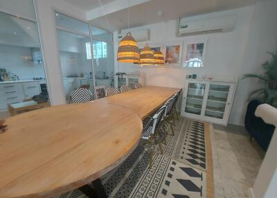 Spacious dining room with large wooden table