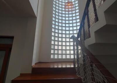 Staircase with large glass block window