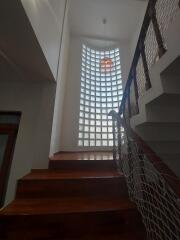 Staircase with large glass block window