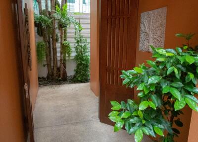 Indoor hallway with plants and greenery