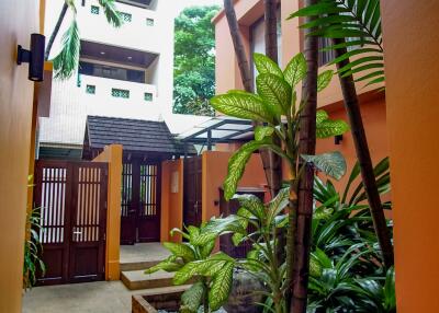 Outdoor garden and walkway leading to main entrance