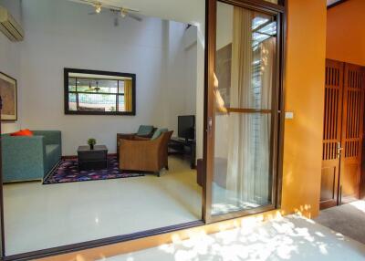 Living room with modern furniture and large glass sliding door