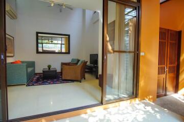 Living room with modern furniture and large glass sliding door