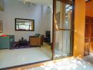 Living room with modern furniture and large glass sliding door