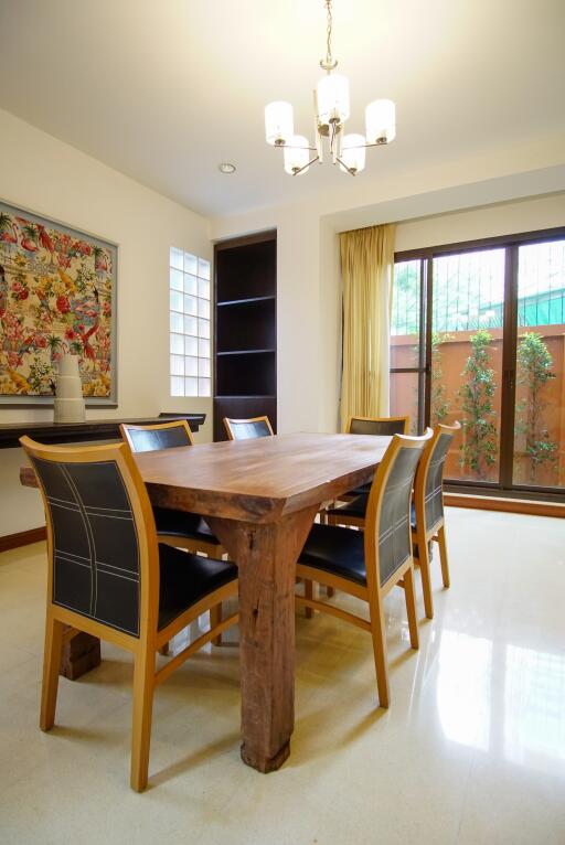 Elegant dining room with wooden table and modern chairs