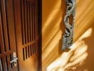 Wooden door with intricately carved decor on wall