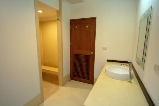 Modern bathroom with sink and separate shower area