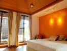 Spacious bedroom with wooden ceiling and modern decor