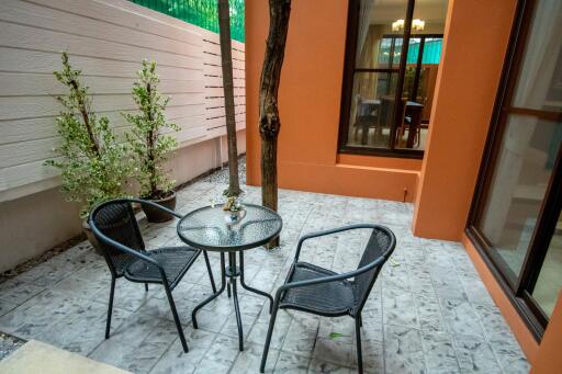 Outdoor patio with table and two chairs