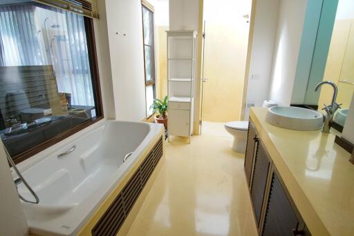 Modern bathroom with bathtub and vanity