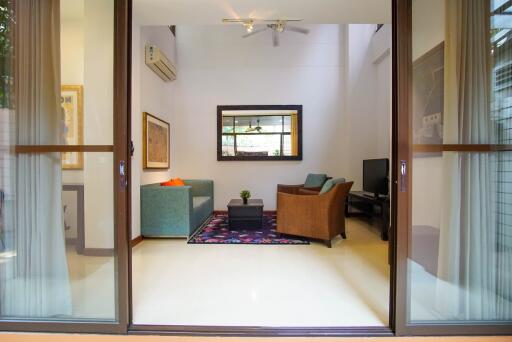 Spacious living room with modern decor and sliding glass doors