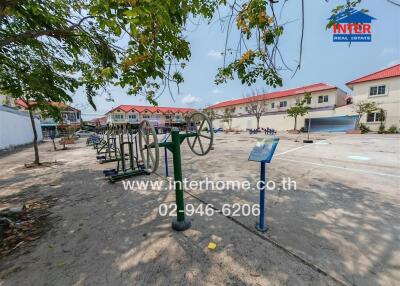 Outdoor fitness area in a residential community with exercise equipment