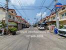 Street view of neighborhood with houses and parked cars