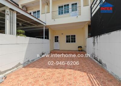 Exterior view of the building with a tile driveway