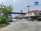 Street view of townhouses and local businesses