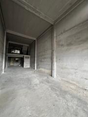 Empty industrial space with concrete walls and floors