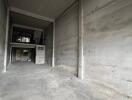 Empty industrial space with concrete walls and floors