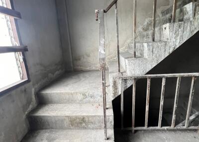 Concrete stairwell with metal railing