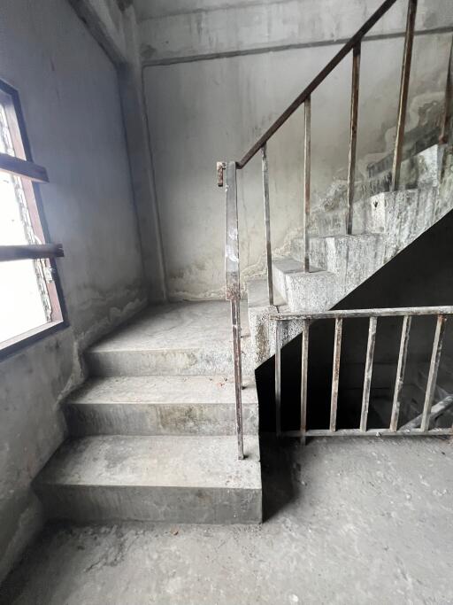 Concrete stairwell with metal railing