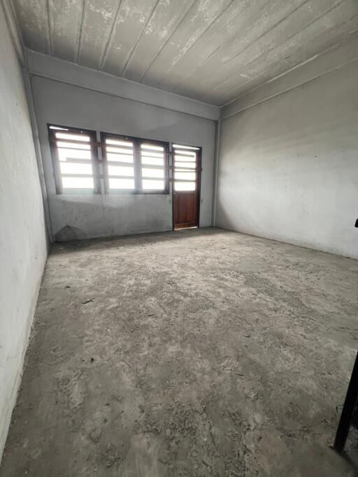 Empty room with a window and door