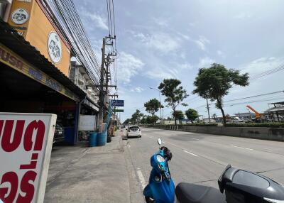 Street view with buildings and parked vehicles