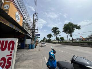 Street view with buildings and parked vehicles