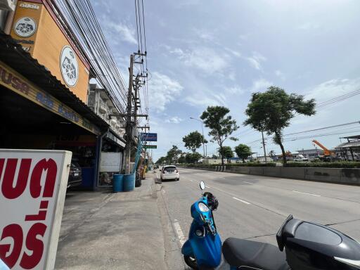 Street view with buildings and parked vehicles